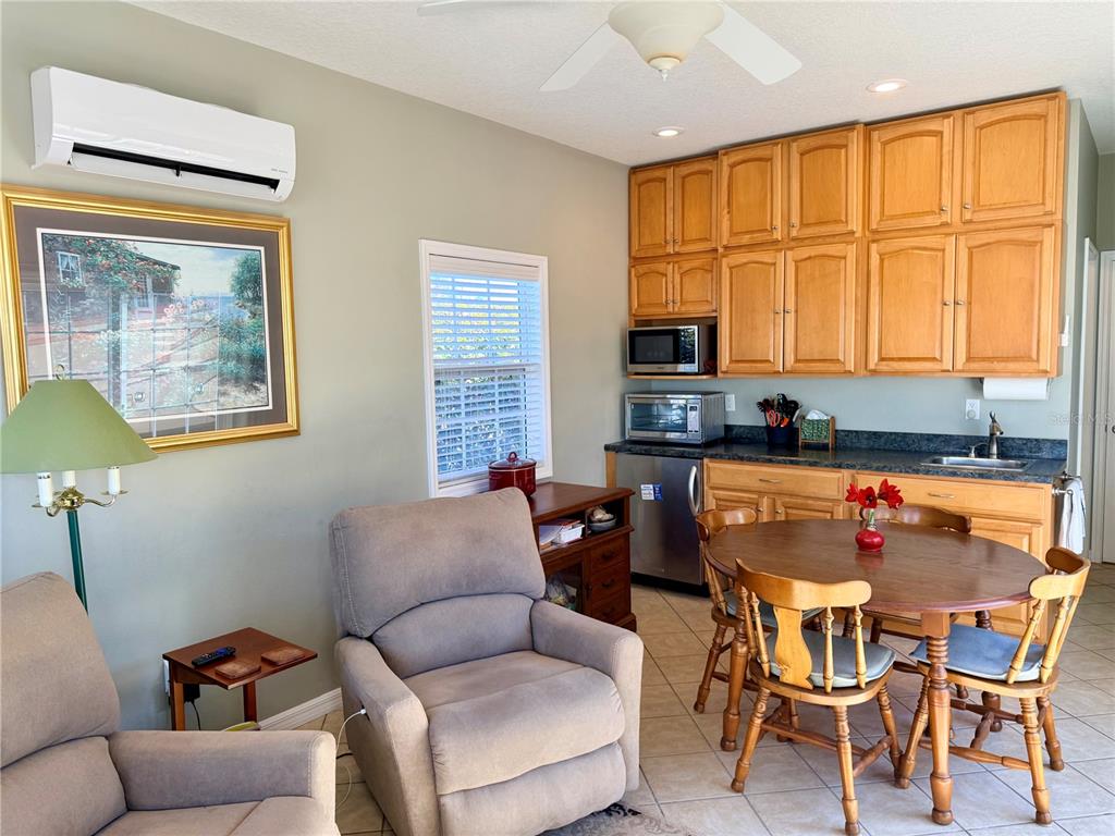 4805 Southeast 94th Avenue Webster, FL 33597 - Photo 13 of 35 a outdoor living space with furniture and a window