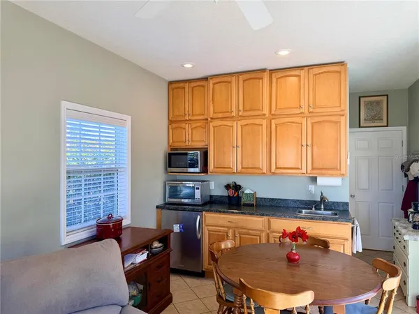 a dining room with furniture and a window