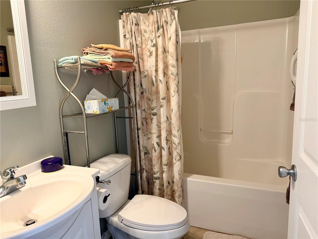 4805 Southeast 94th Avenue Webster, FL 33597 - Photo 15 of 35 a white toilet sitting next to a bath tub