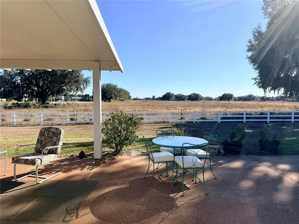 a view of a terrace with furniture and stove