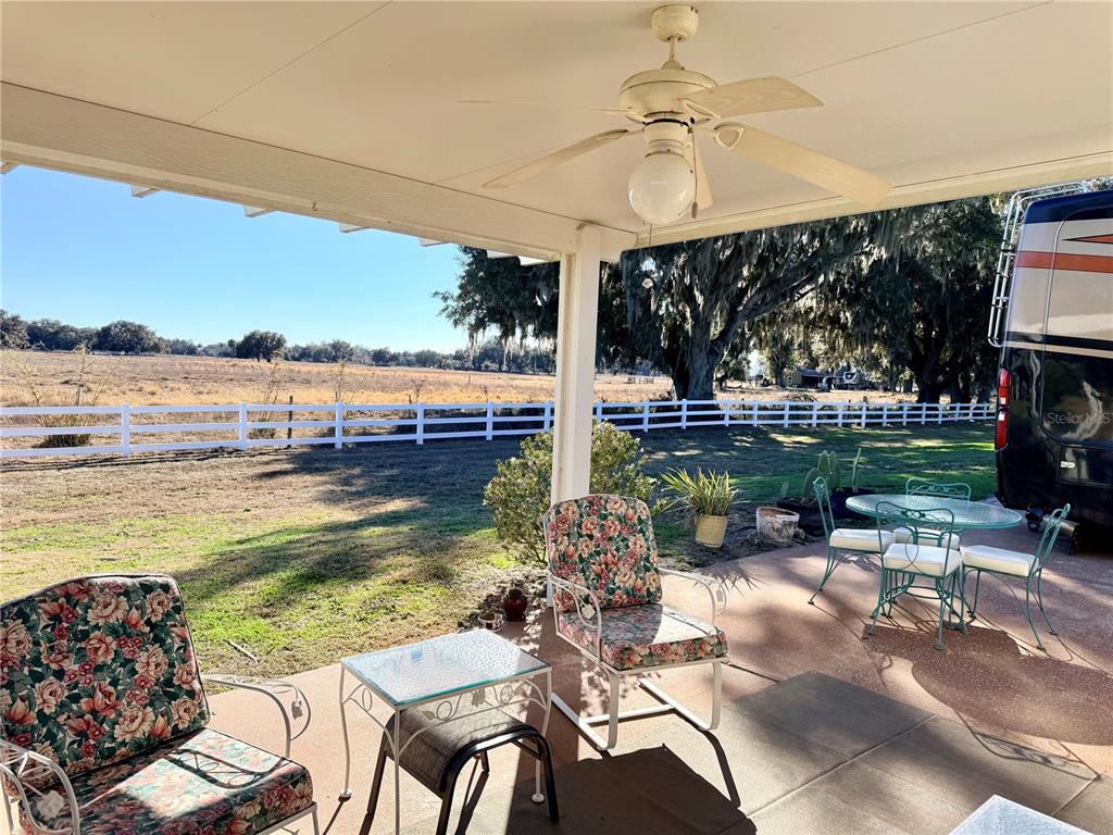 4805 Southeast 94th Avenue Webster, FL 33597 - Photo 5 of 35 a view of a swimming pool with a patio