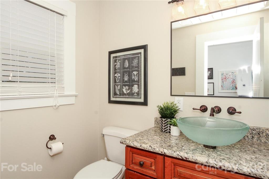 1637 Club Road Charlotte, NC 28205 - Photo 13 of 28 a bathroom with a granite countertop sink and a mirror