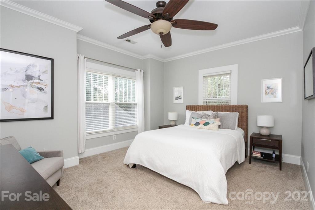 1637 Club Road Charlotte, NC 28205 - Photo 14 of 28 a bedroom with a bed painting on wall and a large window