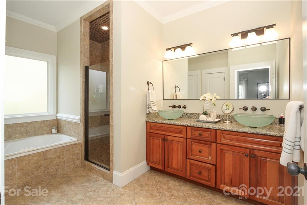 1637 Club Road Charlotte, NC 28205 - Photo 16 of 28 a bathroom with a granite countertop sink mirror and bathtub
