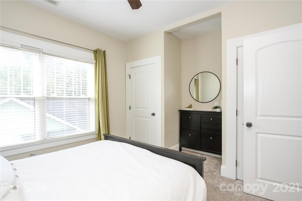 1637 Club Road Charlotte, NC 28205 - Photo 18 of 28 a bedroom with a bed and a window