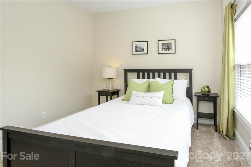 1637 Club Road Charlotte, NC 28205 - Photo 19 of 28 a bedroom with a bed and a night stand