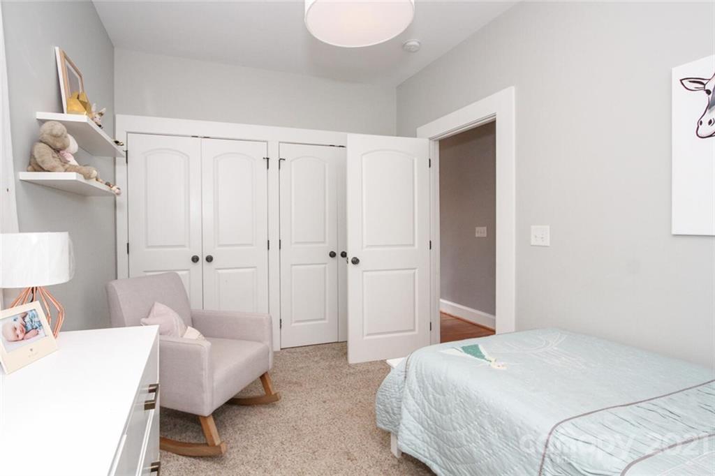 1637 Club Road Charlotte, NC 28205 - Photo 21 of 28 a bedroom with a bed and a couch