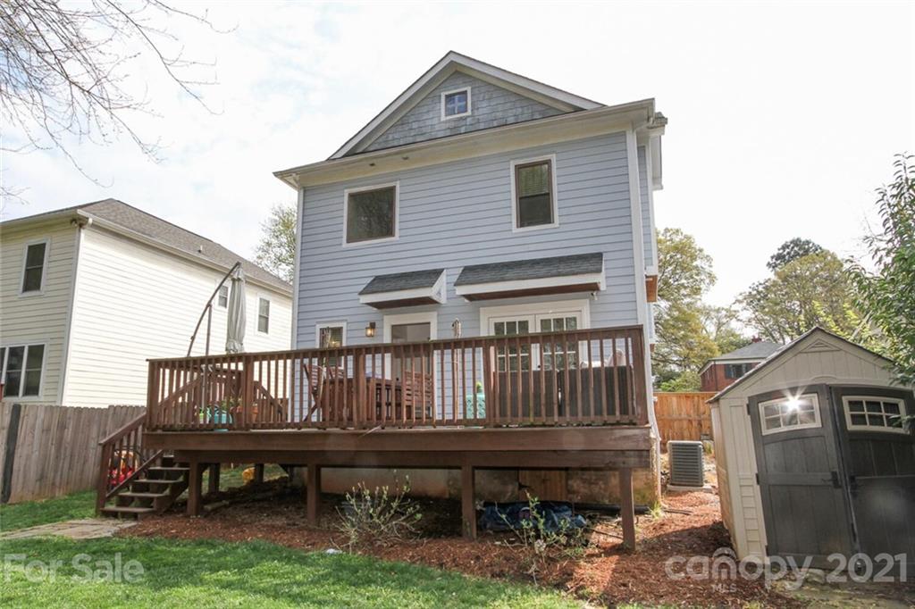 1637 Club Road Charlotte, NC 28205 - Photo 27 of 28 a view of a house with a wooden deck and furniture