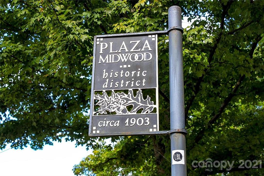 1637 Club Road Charlotte, NC 28205 - Photo 28 of 28 a sign broad in front of the red tree