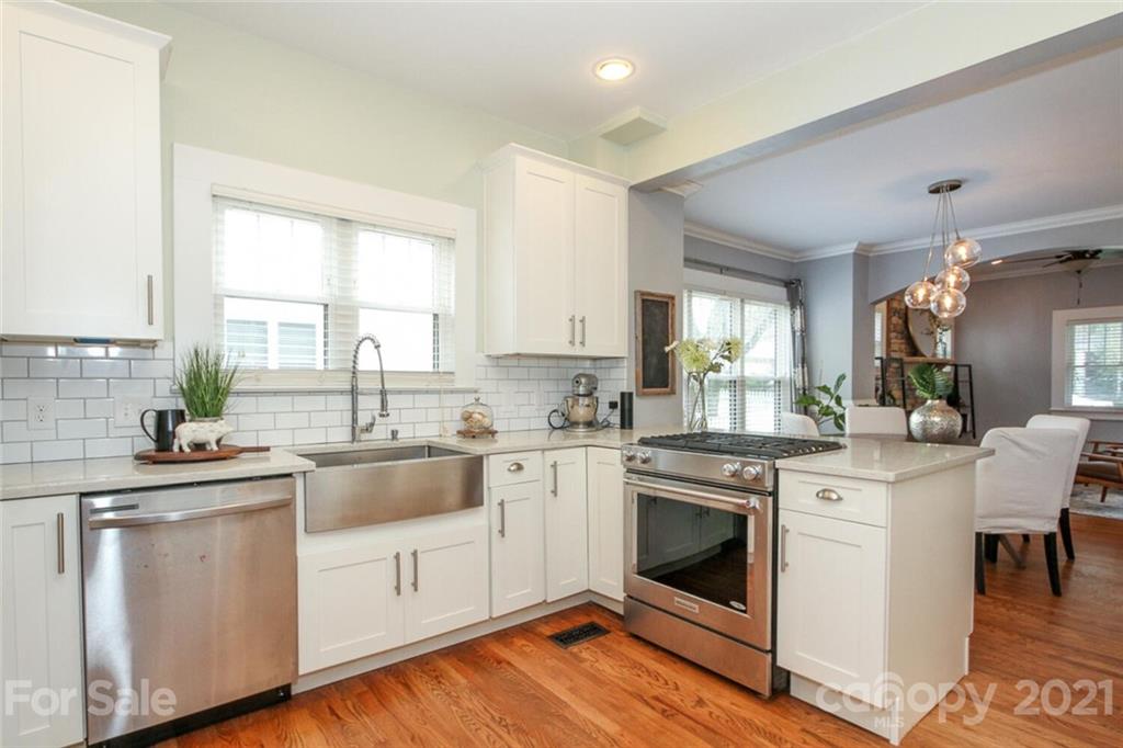 1637 Club Road Charlotte, NC 28205 - Photo 6 of 28 a kitchen with cabinets a sink and appliances