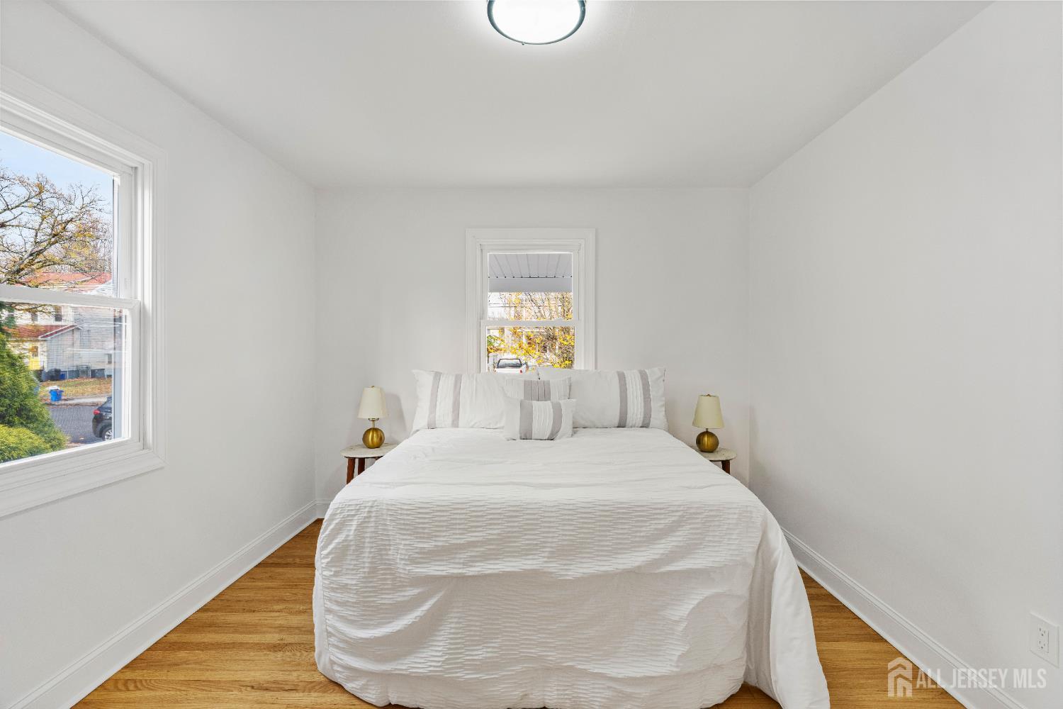 709 Front Street Dunellen, NJ 08812 - Photo 14 of 34 a bedroom with a bed and window