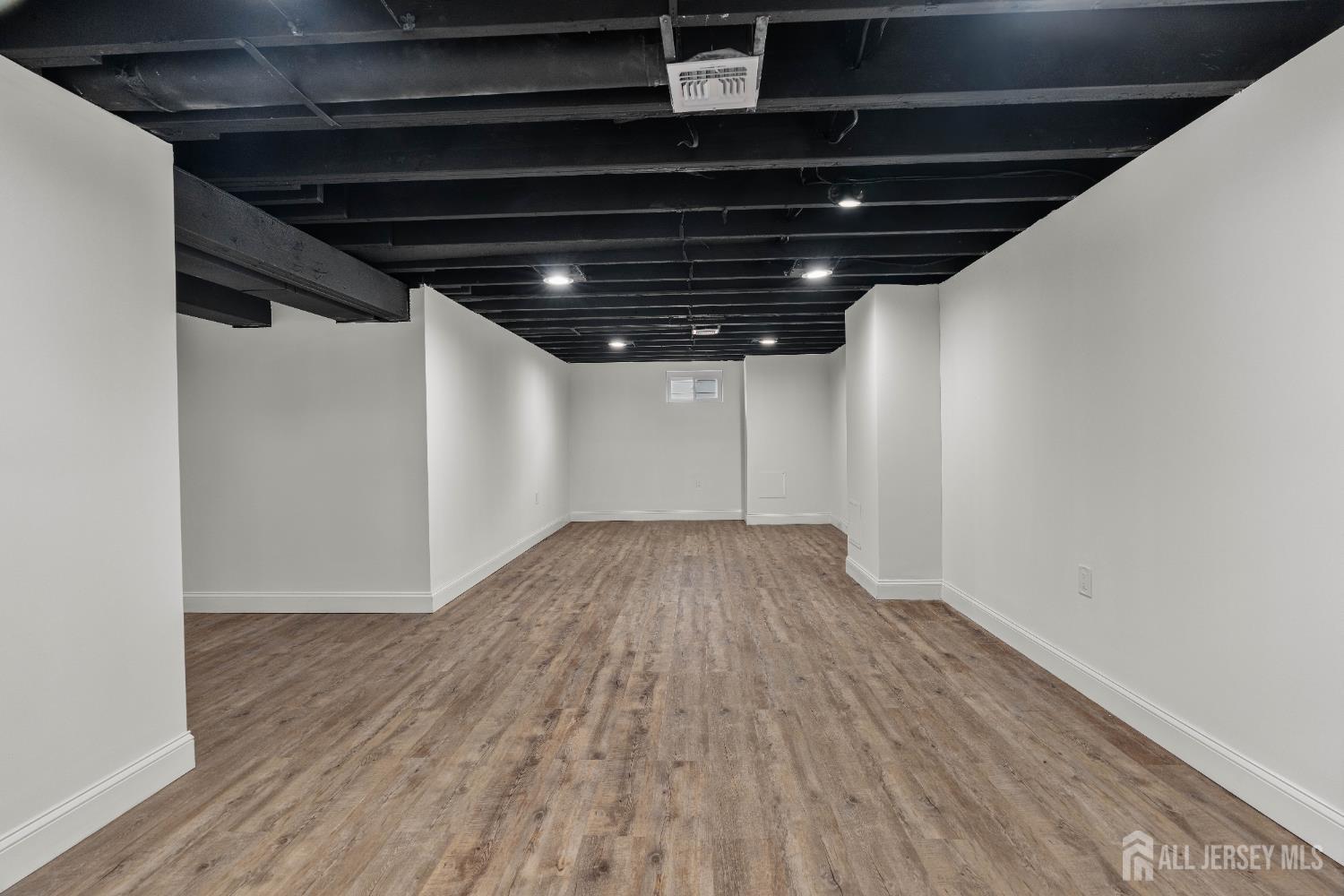 709 Front Street Dunellen, NJ 08812 - Photo 23 of 34 a view of empty room with wooden floor