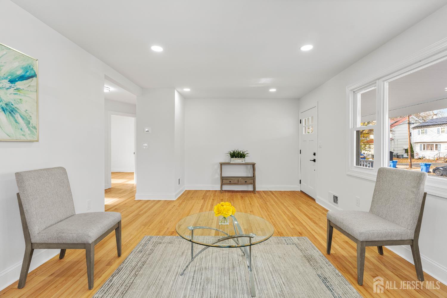 709 Front Street Dunellen, NJ 08812 - Photo 6 of 34 a living room with furniture and a table