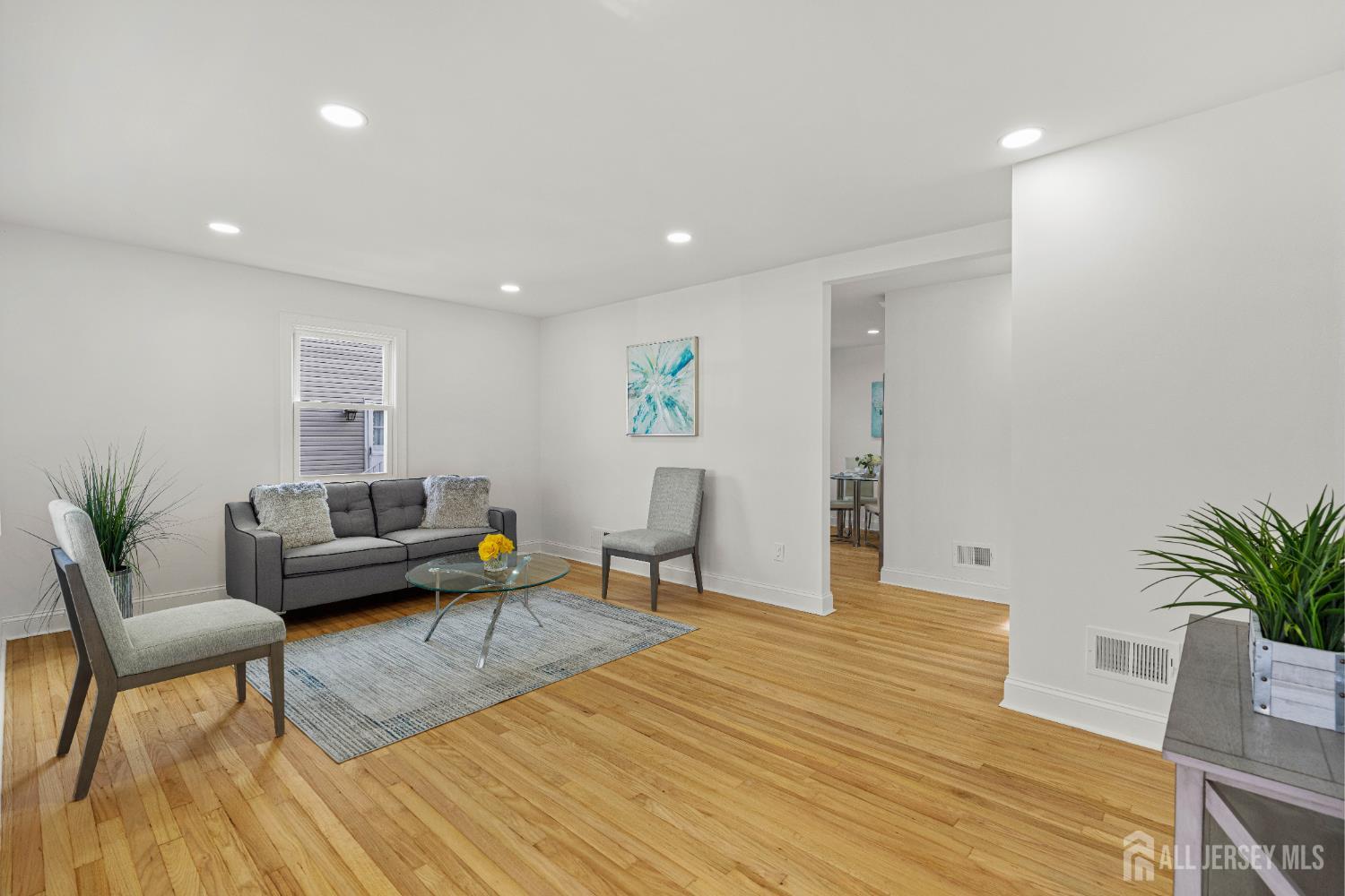 709 Front Street Dunellen, NJ 08812 - Photo 7 of 34 a living room with furniture and a wooden floor