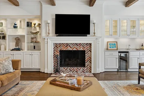 a kitchen with stainless steel appliances granite countertop a sink and cabinets with wooden floor