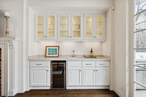 a bathroom with a sink a mirror and vanity