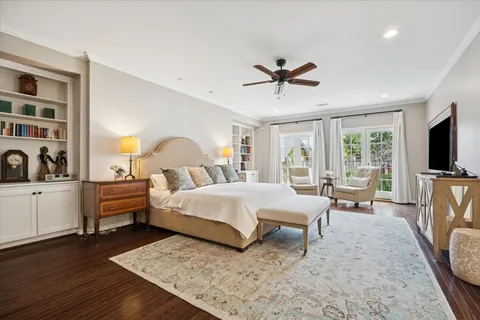 a bedroom with a bed and a book shelf