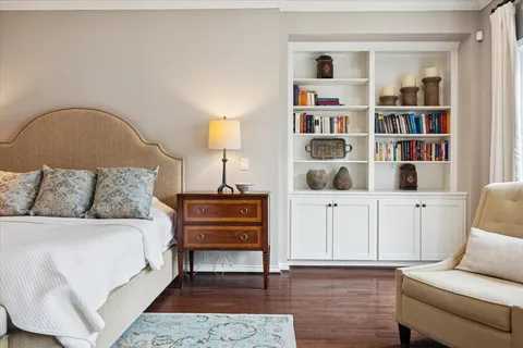 a spacious bathroom with double vanity sinks a large mirror and a bathtub