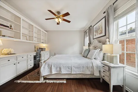 a living room with furniture and a dresser