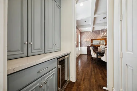 a kitchen with stainless steel appliances granite countertop lots of counter space and wooden floors