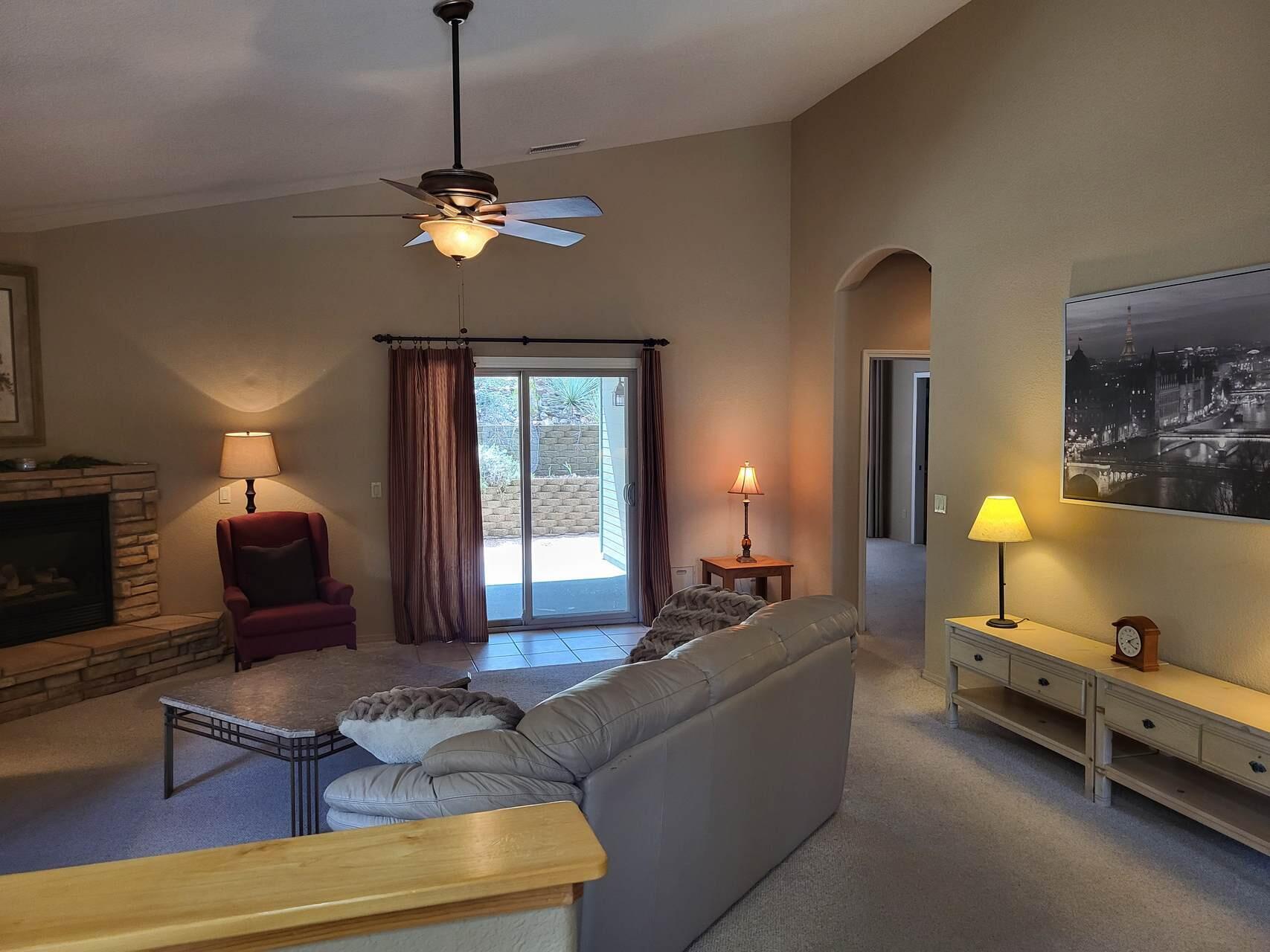 1120 South Sycamore Circle Payson, AZ 85541 - Photo 14 of 44 a living room with furniture and a chandelier
