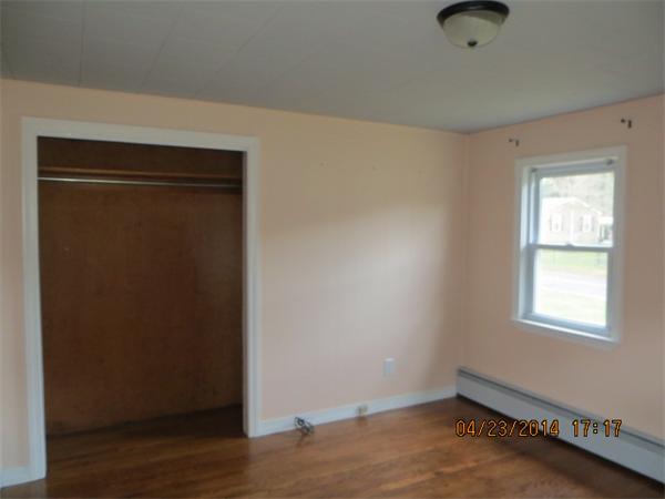 62 Chipaway Road Freetown, MA 02717 - Photo 11 of 14 an empty room with wooden floor closet and windows