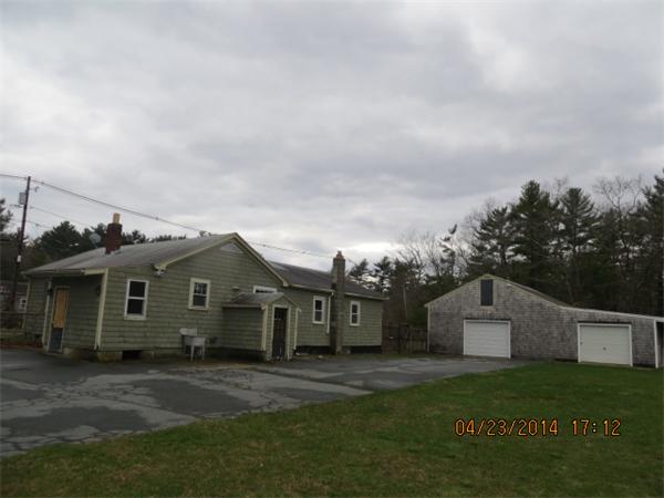 62 Chipaway Road Freetown, MA 02717 - Photo 2 of 14 a front view of a house with a garden and yard