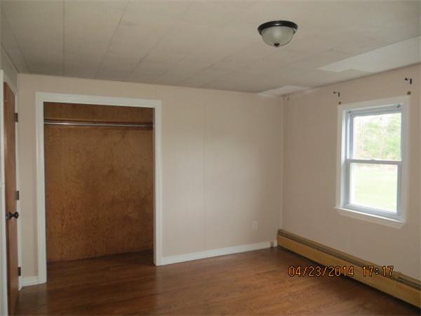 62 Chipaway Road Freetown, MA 02717 - Photo 9 of 14 an empty room with wooden floor and windows