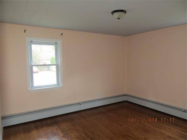 62 Chipaway Road Freetown, MA 02717 - Photo 10 of 14 a view of an empty room with wooden floor and a window
