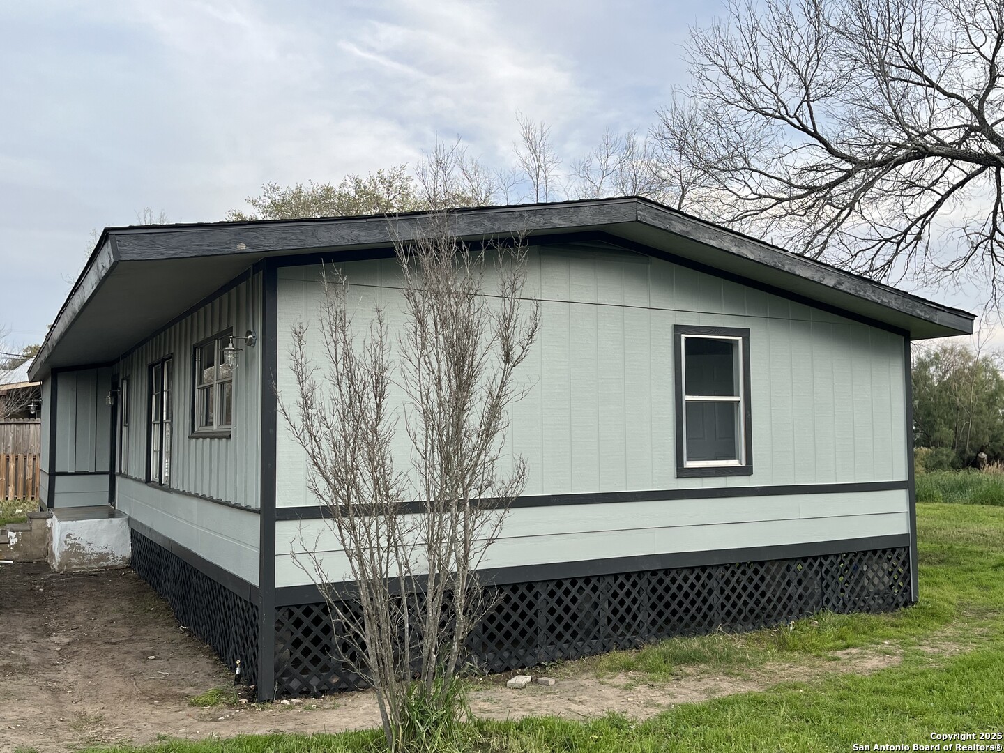 302 Ross Avenue Devine, TX 78016 - Photo 7 of 20 a view of a house with a window