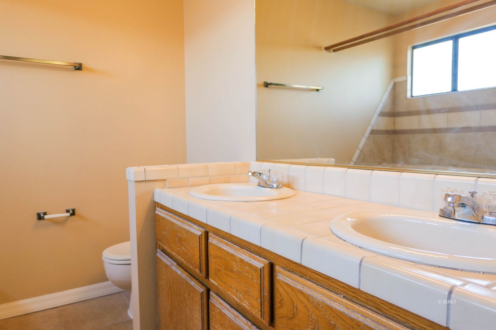 601 Heather Court Ridgecrest, CA 93555 - Photo 27 of 45 a bathroom with a sink and a vanity