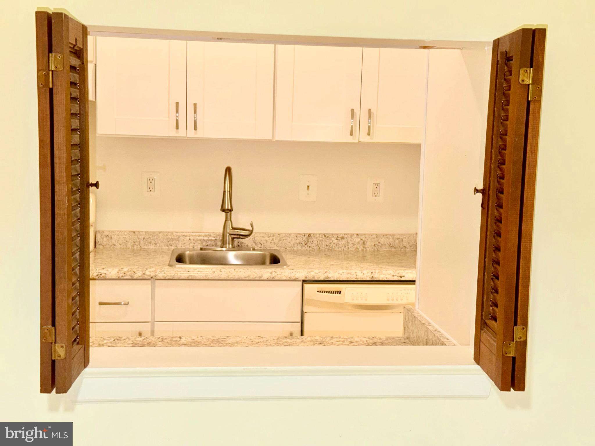 5918 Cove Landing Road, Unit 202 Burke, VA 22015 - Photo 14 of 26 Window from the Dining Area into the Kitchen.