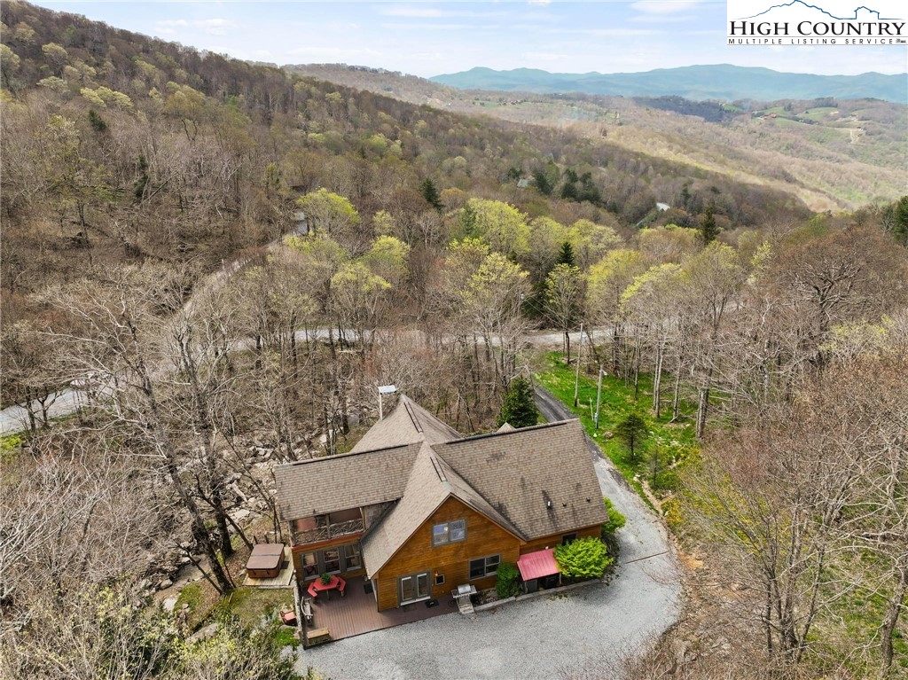 140 Spruce Hollow Road Beech Mountain, NC 28604 - Photo 2 of 50 a car parked on the side of the road