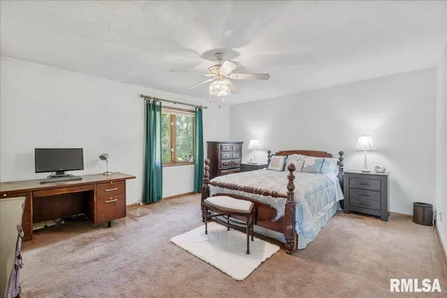 a bed room with a bed and a dresser