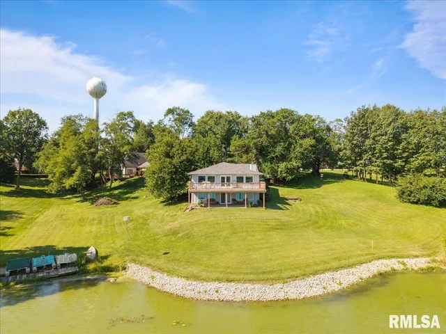 a view of a swimming pool with an outdoor space and seating area