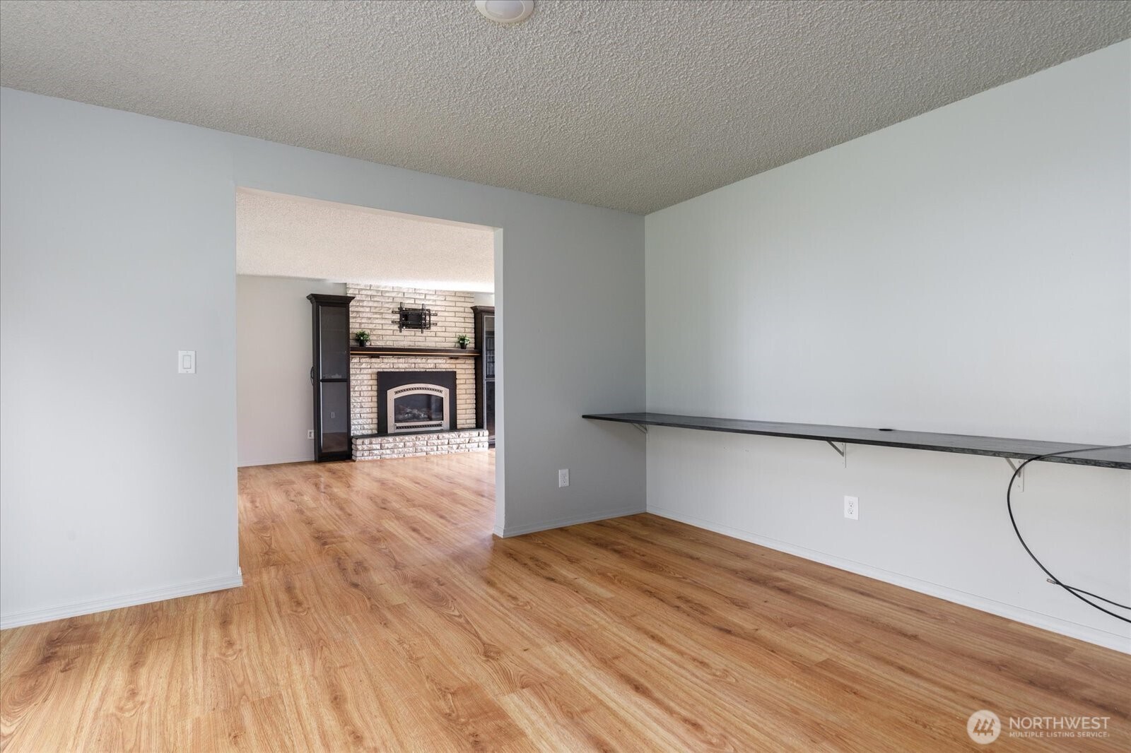 960 Southwest Capital Street Oak Harbor, WA 98277 - Photo 18 of 40 a view of empty room with wooden floor