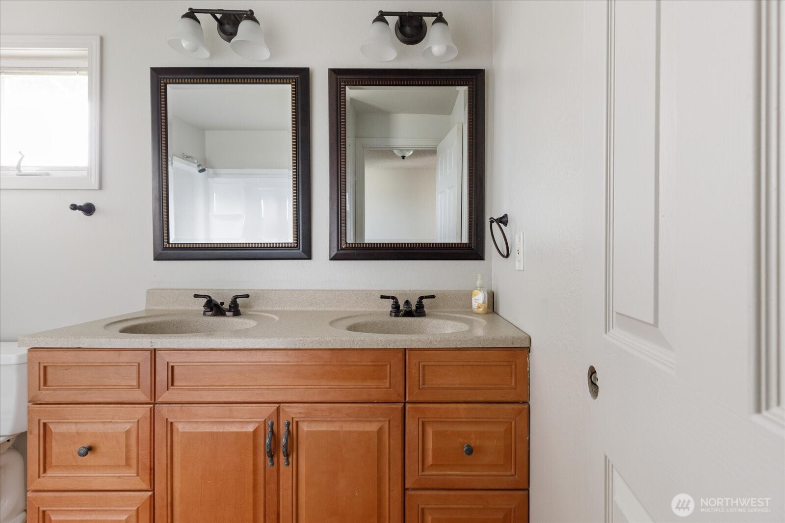 960 Southwest Capital Street Oak Harbor, WA 98277 - Photo 26 of 40 a bathroom with a sink and a mirror