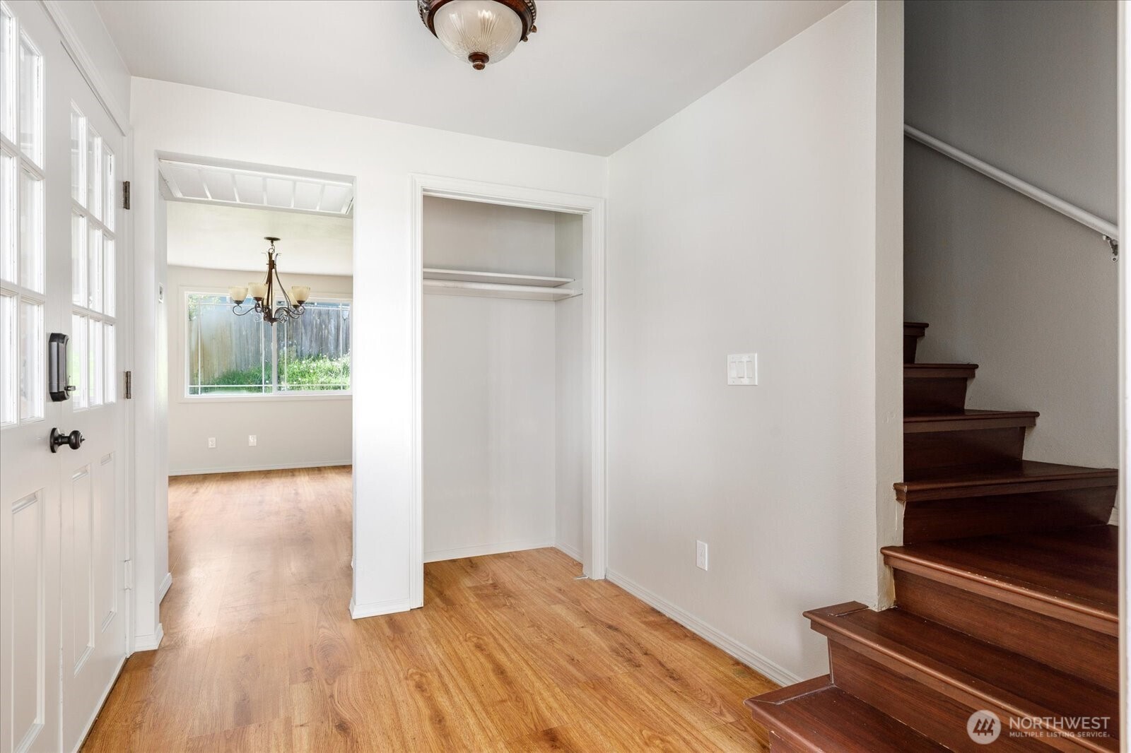 960 Southwest Capital Street Oak Harbor, WA 98277 - Photo 8 of 40 a view of a hallway with wooden floor and staircase