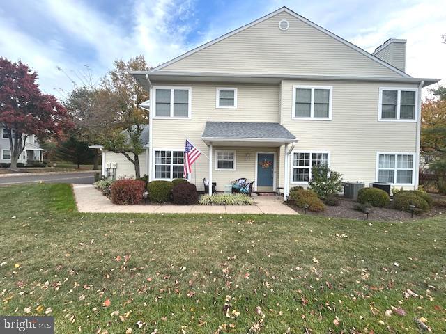2007 Waterford Road Yardley, PA 19067 - Photo 1 of 44 a front view of a house with a yard and porch