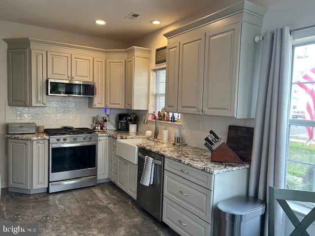 2007 Waterford Road Yardley, PA 19067 - Photo 3 of 44 a kitchen with stainless steel appliances granite countertop a stove a sink and a microwave