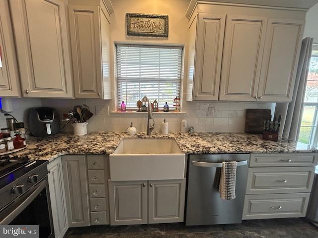 2007 Waterford Road Yardley, PA 19067 - Photo 4 of 44 a kitchen with stainless steel appliances granite countertop a sink stove and cabinets