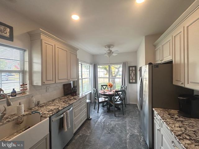 2007 Waterford Road Yardley, PA 19067 - Photo 7 of 44 a kitchen with stainless steel appliances granite countertop a stove refrigerator sink and cabinets