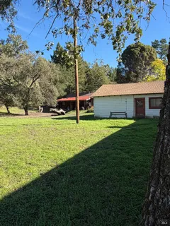 a view of a house with a big yard