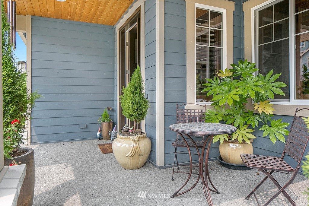 19809 3rd Avenue Southeast Bothell, WA 98012 - Photo 2 of 21 a view of a backyard with table and chairs potted plants