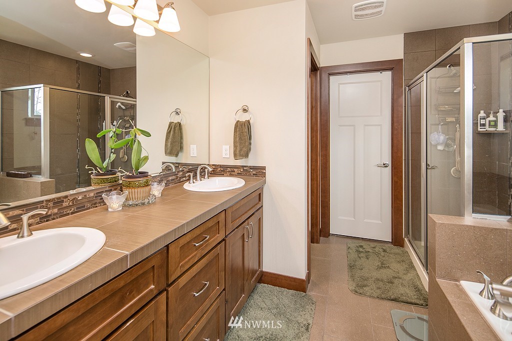 19809 3rd Avenue Southeast Bothell, WA 98012 - Photo 13 of 21 a bathroom with a sink double vanity and a mirror
