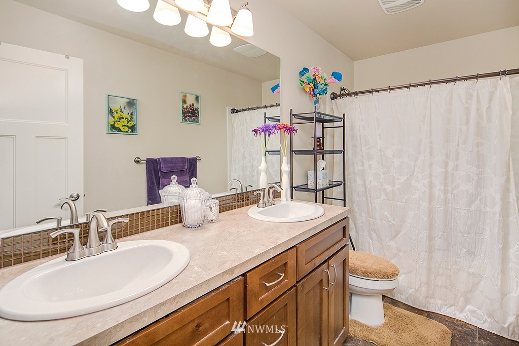 19809 3rd Avenue Southeast Bothell, WA 98012 - Photo 16 of 21 a bathroom with a sink a vanity and a mirror