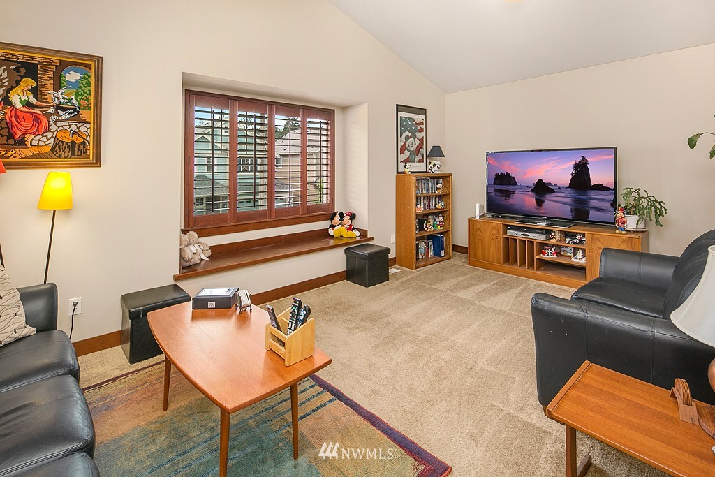19809 3rd Avenue Southeast Bothell, WA 98012 - Photo 17 of 21 a living room with furniture a couch and a flat screen tv