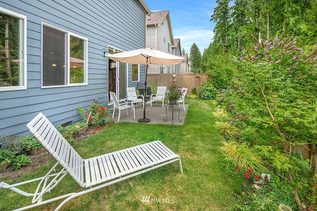 19809 3rd Avenue Southeast Bothell, WA 98012 - Photo 21 of 21 a view of a chair and table in backyard of the house