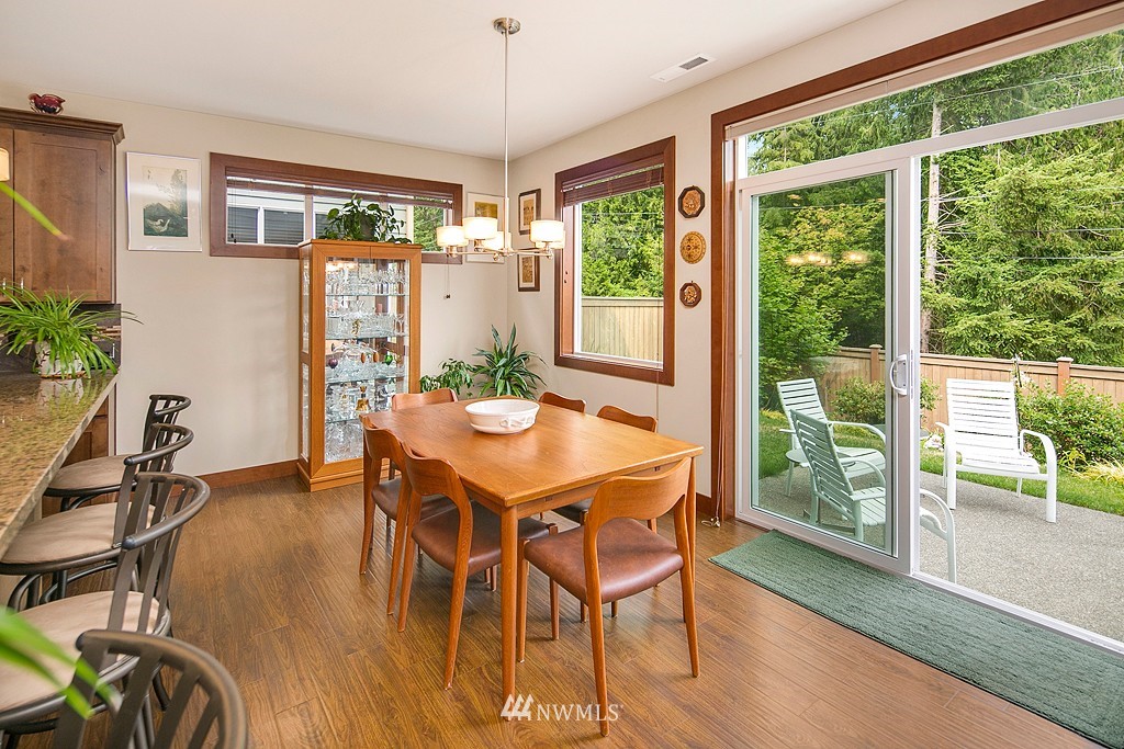 19809 3rd Avenue Southeast Bothell, WA 98012 - Photo 7 of 21 a view of a dining room with furniture window and wooden floor