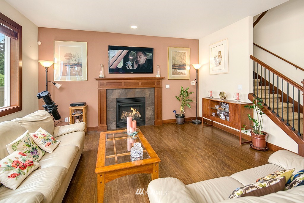 19809 3rd Avenue Southeast Bothell, WA 98012 - Photo 10 of 21 a living room with furniture and a fireplace